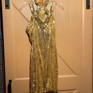 Short gold sequence gown with front crisscross strap